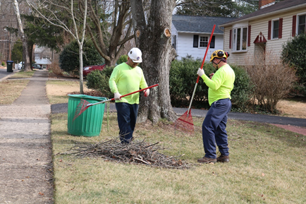 RTEC groundsmen clean up debris after completing a job